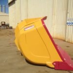 Outcast underground loader bucket showing underside of bucket floor stepped up lip plate