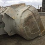 Rear/side view of Outcast underground loader bucket after use. Shows absence of structural damage in areas usually covered by heel shrouds.