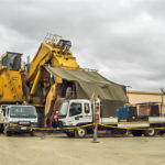 Two boilermaking service trucks providing equipment for servicing Komatsu PC8000 shovel during day shift